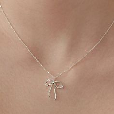 Sterling Silver Bow Necklace, Sparkling Crystal Bow Charm Necklace, Bow Jewelry, Silver Necklace, Perfect Gift for Her (NZ2182) ▶ Product Info. - Material: 925 Sterling Silver / Cubic Zirconia - Metal Finish: 14K Gold / Silver + Anti-Tarnish E-Coat  - Safety: Nickle & Lead free and Hypoallergenic - Dimensions: Pendant - 17.4mm x 21mm w/width 3.2mm / Cubic Zirconia - 3.5mm - Length: 40cm + 3.5cm (length adjustable) - Weight: 3g - TATIANA & Silver 925 engraved tag was added. - Made In South Korea Girly Jewelry Silver, Elegant Silver Necklace For Gift, Elegant Sterling Silver Necklaces For Gifts, Elegant Round Pendant Necklaces As Gift, Elegant Round Pendant Necklaces For Gifts, Elegant Pendant Charm Necklaces, Silver Necklace Party Gift, Silver Necklace For Party Or As A Gift, Silver Necklace For Party Or Gift