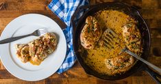 a skillet filled with chicken covered in gravy