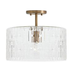 a semi flush ceiling light with clear glass shades