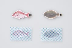 three fish magnets are placed on top of each other in different shapes and sizes