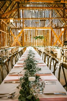 A bath decorated for a wedding in the Ottawa Valley. Photo by Cindy Lottes Photography Barn Wedding Fairy Lights, Late September Wedding, Indoor Rustic Wedding Reception Decor Twinkle Lights, Fairy Lights Wedding Barn, Fairy Lights Wedding Reception Barn, Hanging Lights In Barn Wedding, Boho Updo, Ottawa Valley, Fall Wedding Tables