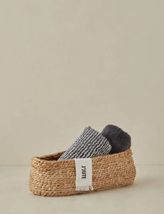 two pairs of socks sitting on top of a basket