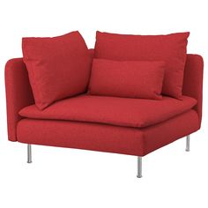 a red couch with two pillows on the armrests and one pillow sitting on top of it