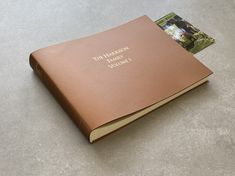 a brown book sitting on top of a table