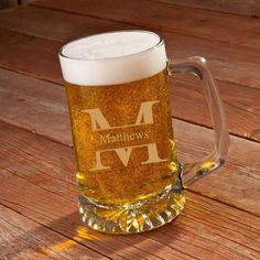 a beer mug sitting on top of a wooden table