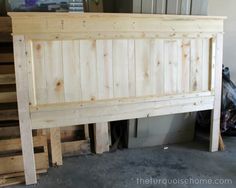 a bed frame made out of wooden pallets