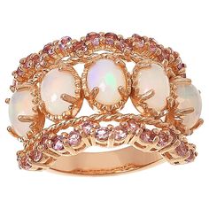 Colleen Lopez Opal and Pink Tourmaline Scalloped Wide Band Ring  This Colleen Lopez ring features stunning opals set on a wide band, plus pretty pink tourmaline stones along the scallop-edged design. Rose gold plating adds a touch of elegance to the already beautiful piece.       Approx. 5/8"L x 1"W x 3/16"H; shank 1/8"W     Stamped .925 sterling silver; rose gold plating   Stone Information       All sizes and weights approximate     White Opal - Oval (7x5mm)     Pink Tourmaline - Round; 1.12ct