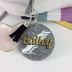 a keychain with the word bailey on it