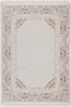 a beige rug with an ornate border