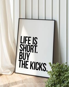 a black and white poster with the words life is short buy the kicks on it