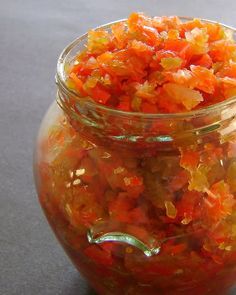 a glass jar filled with orange and yellow gummy bears