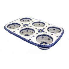 a blue and white tray with six bowls in it