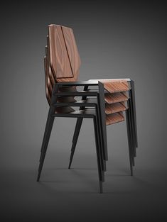 three chairs are stacked on top of each other, one is made out of wood