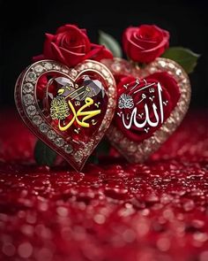 two hearts with arabic writing on them and some red roses in the foreground,