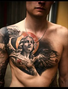 a man with an angel tattoo on his chest