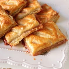 a white plate topped with pastries on top of a table