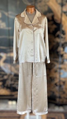 These high-end charmeuse silk pajamas are 100% natural, allergen-free and hypoallergenic. Kumi Kookoon is world-renowned for its fine, high quality silk products. Handmade 100% charmeuse silk Color: Ivory Measurements: SmallChest width: 20.5"Sleeves: 21.5"Elastic waistHips: 21.5"Pants length: 40.4" MediumChest width: 22"Sleeves: 23"Elastic waistHips: 23"Pants length: 42" LargeChest width: 23"Sleeves: 23.5Elastic waistHips: 24"Pants length 43" Chic Silk Sleepwear With Satin Finish, Elegant Satin Sleepwear For Pajama Party, Chic Silk Long Sleeve Sleepwear, Chic Long Sleeve Silk Sleepwear, Luxury Silk Long Sleeve Sleepwear, Luxury Long Sleeve Silk Sleepwear, Elegant Satin Sleepwear, Silk Long Sleeve Bedtime Set, Cream Silk Sleepwear