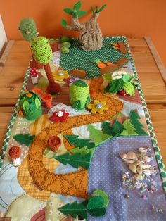 a table topped with lots of different types of crafts