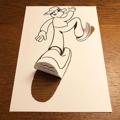 a piece of paper cut out to look like a cartoon character on a skateboard