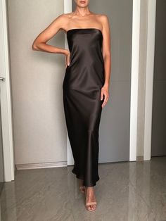 Strapless silk satin slip dress. Can be worn as a bridesmaid dress, party and date dress and for many other occasions. Made of satin silk. DESCRİPTİON:   -Strapless.  -Elastic band on the bust part.  -Adjustable bust.  -Designed for a slim but relaxed fit.  -Unlined.  -Bias cut. İt is a custom made dress, tailored according to your preferences, you can choose the length of the dress and order it without cut on the front.  While ordering write your bust and waist measure, so the dress will be made to your size. Please enquire if you're interested in different color. SIZING INFO: XS/34/US4: bust: 82-86cm (32-33 inch) waist 64-66 cm (24-25 inch)  S/36/ US6: bust: 86-88cm (33-34 inch) waist: 66-68 cm (25-26 inch) M/38/ US8: bust: 88-92 cm (34-36 inch) waist: 68-72 cm (26-28 inch) L/40/ US10: Long Tube Top Dress, Silk Strapless Dress With Satin Finish For Party, Silk Dress With Satin Lining For Night Out, Strapless Silk Satin Dress For Night Out, Formal Silk Satin Dress With Straight Neckline, Silk Dress With Satin Finish And Straight Neckline, Sleek Bridesmaid Slip Dress, Sleek Satin Bridesmaid Dresses, Silk Strapless Dress With Straight Neckline For Party