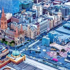 an aerial view of a city with tall buildings