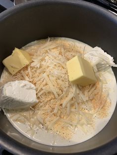 cheese and butter are mixed together in a pan