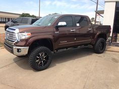 a brown truck parked in front of a building