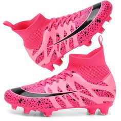 a pair of pink and black soccer cleats with spikes on the soles