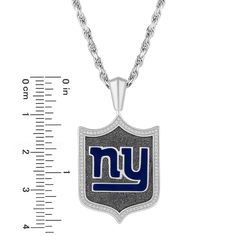 Share your passion for your team with this New York Giants diamond shield pendant from the True Fans Fine Jewelry Collection. Sterling Silver One side showcases the New York Giants logo in blue enamel and a diamond-lined border. The NFL shield logo shines on the reverse side. This 1/5 ct. t.w. diamond pendant suspends along a 22.0-inch rope chain that secures with a lobster clasp. Officially licensed NFL jewelry All 32 Teams available Nfl Jewelry, Leo Diamond, New York Giants Logo, Giants Logo, Mens Gemstone Rings, Wedding Ring Necklaces, Shield Logo, Fine Jewelry Collection, Gold Diamond Rings