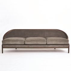 Tailored Sofa is distinguished by the sleek pinstripe fabric around the back support. A beautiful wooden base supports the sofa and is accentuated along the bottom edge with a filet of solid brass running around the entire frame of the sofa. Elegant shapely legs and frame are finished in a dark waxed oiled walnut finish. Dimensions Overall 95.75"W x 32"H x 28.75"D (130 lbs) Leg 7.25"H  Weight Limit - 300 lbs per seat (900 lbs total) Solid Beech Brass Trim 33% Polester, 51% Cotton, 16% Acrylic  F Couch Reupholster, Accent Couch, Sofa Elegant, Pinstripe Fabric, Sofa New, Milan Apartment, Velvet Lounge Chair, Professional Interior Design, Unique Sofas