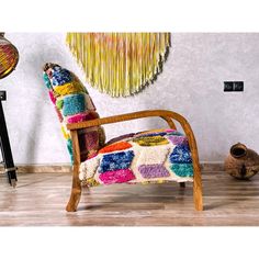 a colorful chair sitting in front of a wall