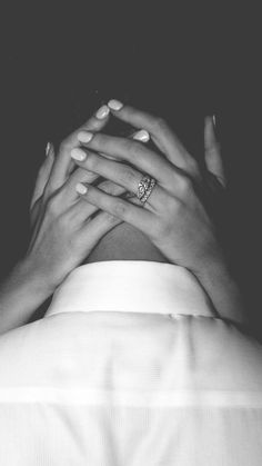 black and white photograph of two hands holding each other