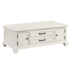 a white coffee table with two drawers