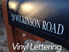 a close up of a mailbox with the words vinyl lettering on it