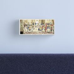 a group of people standing around in a room with blue walls canvas print on wall