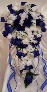 a bridal bouquet with blue ribbon and white flowers