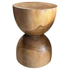 a wooden bowl sitting on top of a table