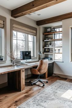 a home office with two windows and a rug on the floor in front of it