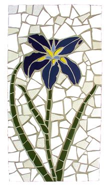 a stained glass flower with blue and yellow petals on a white background, surrounded by small mosaic tiles