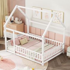 a white doll house bed with pink sheets and pillows on the floor in a bedroom