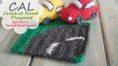 crochet road playmat with cars on it and the text, cal crochet road playmat