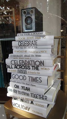 a stack of books sitting on top of a table