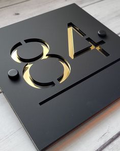 a black and gold sign with the number forty eight on it