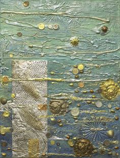 an abstract painting with gold and silver circles on blue paper, surrounded by other objects