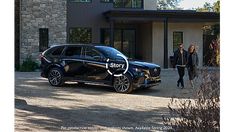 a black suv parked in front of a house with a story written on the side