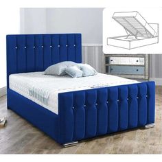 a bed with blue upholstered headboard and foot board on the bottom side