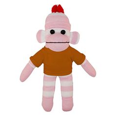 a pink and yellow stuffed animal with black eyes, wearing a yellow shirt and striped leggings