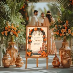 an outdoor ceremony with flowers and vases