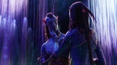 two women dressed in blue and purple are standing next to each other with long dreadlocks