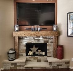 a living room with a fire place and flat screen tv on the wall above it